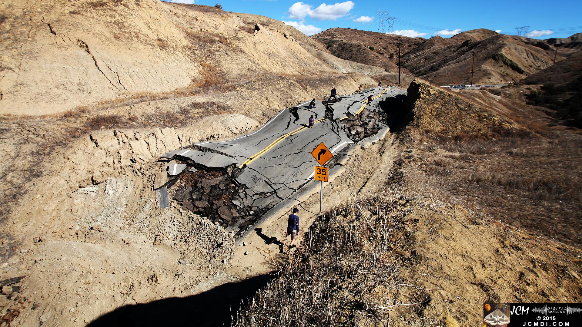 Landslide, buckled pavement, and terrain at Vasquez Canyon Road in Santa Clarita, CA filmed 11-25-2015